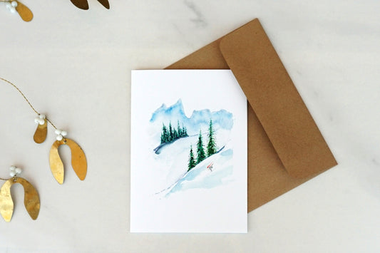 Mountain scene with downhill skier, blank Christmas card